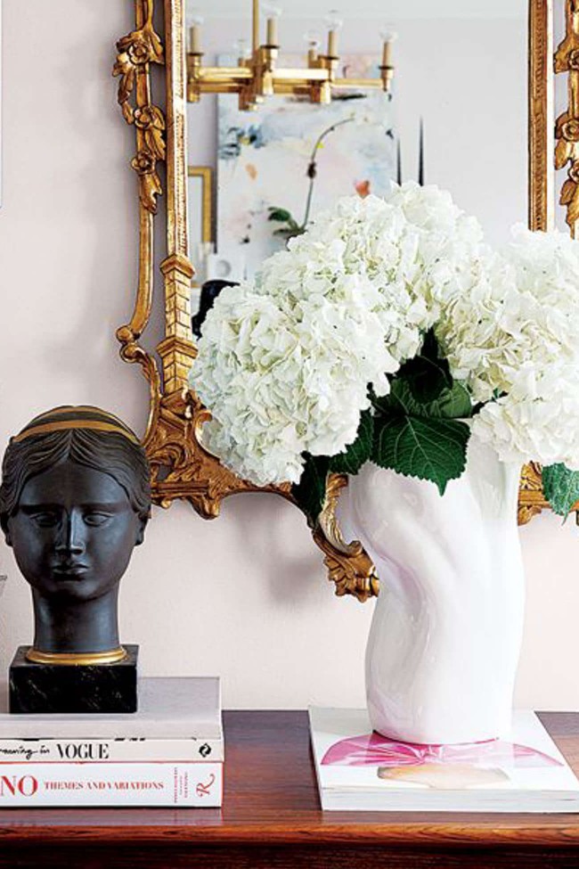 coffee table books displayed in a vignette with hydrangeas