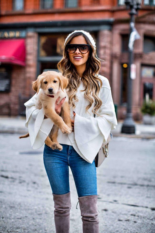 mn fashion blogger mia mia mine wearing a white sweater from shopbop with golden retriever puppy