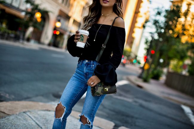 fashion blogger mia mia mine wearing levi's jeans and a bell sleeve top from asos