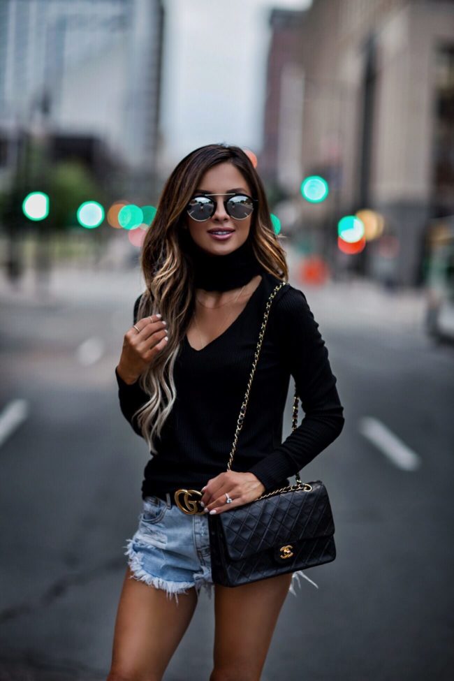 fashion blogger mia mia mine wearing a cutout lna sweater and one teaspoon denim shorts with a chanel 2.55 bag