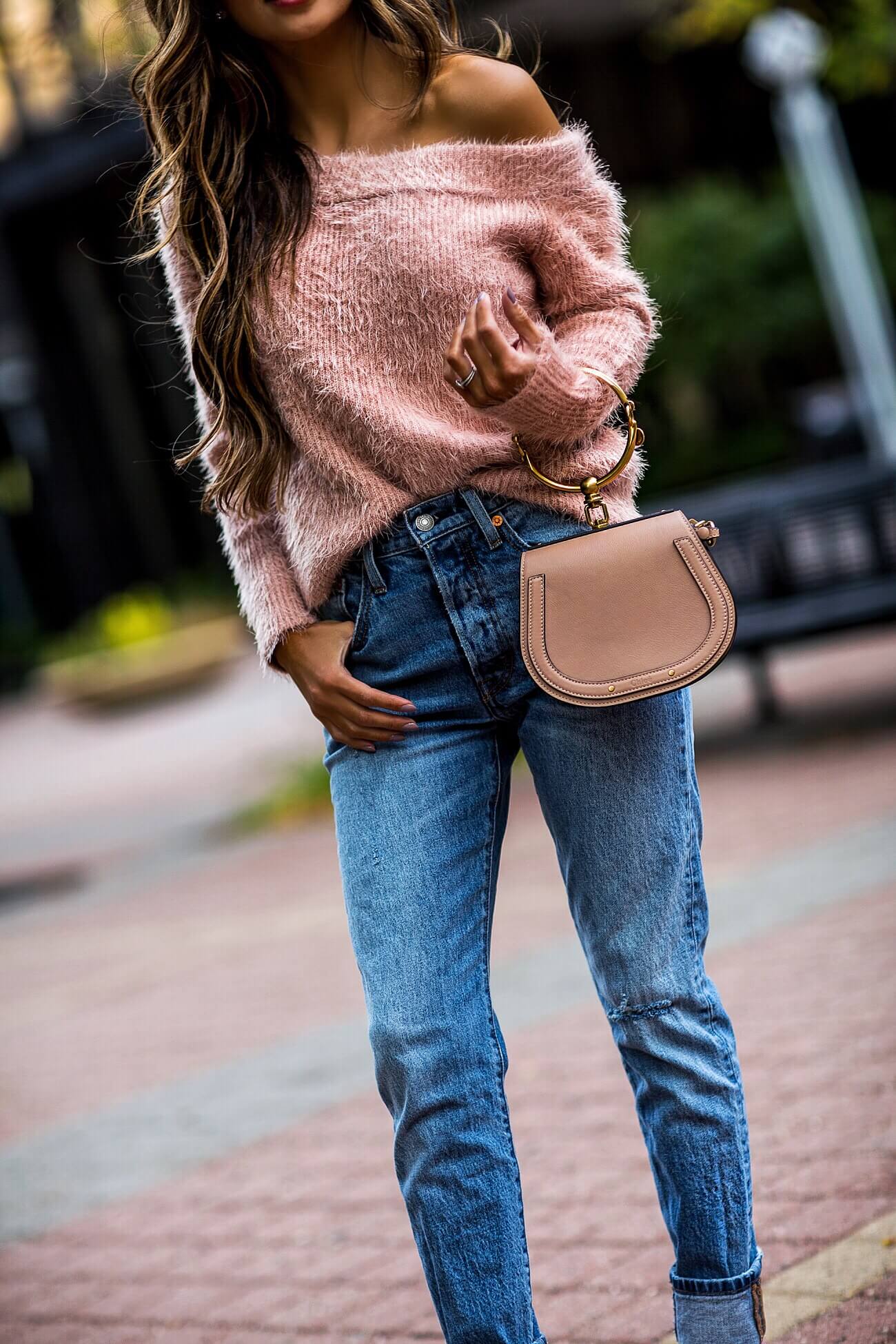 fashion blogger mia mia mine wearing a pink sweater by minkpink and a chloe nile bag