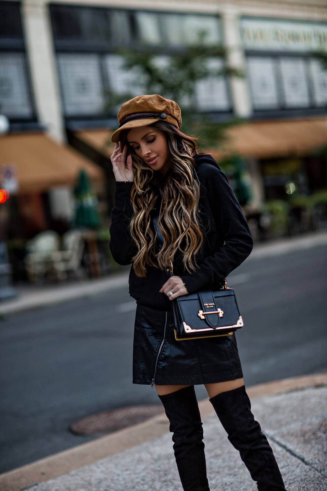 fashion blogger mia mia mine wearing a free people baker boy hat a free people leather mini skirt