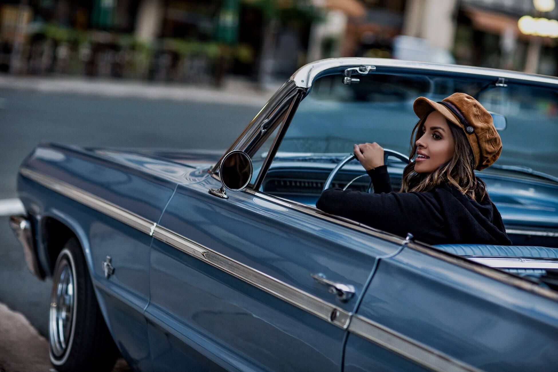 fashion blogger mia mia mine driving a vintage car