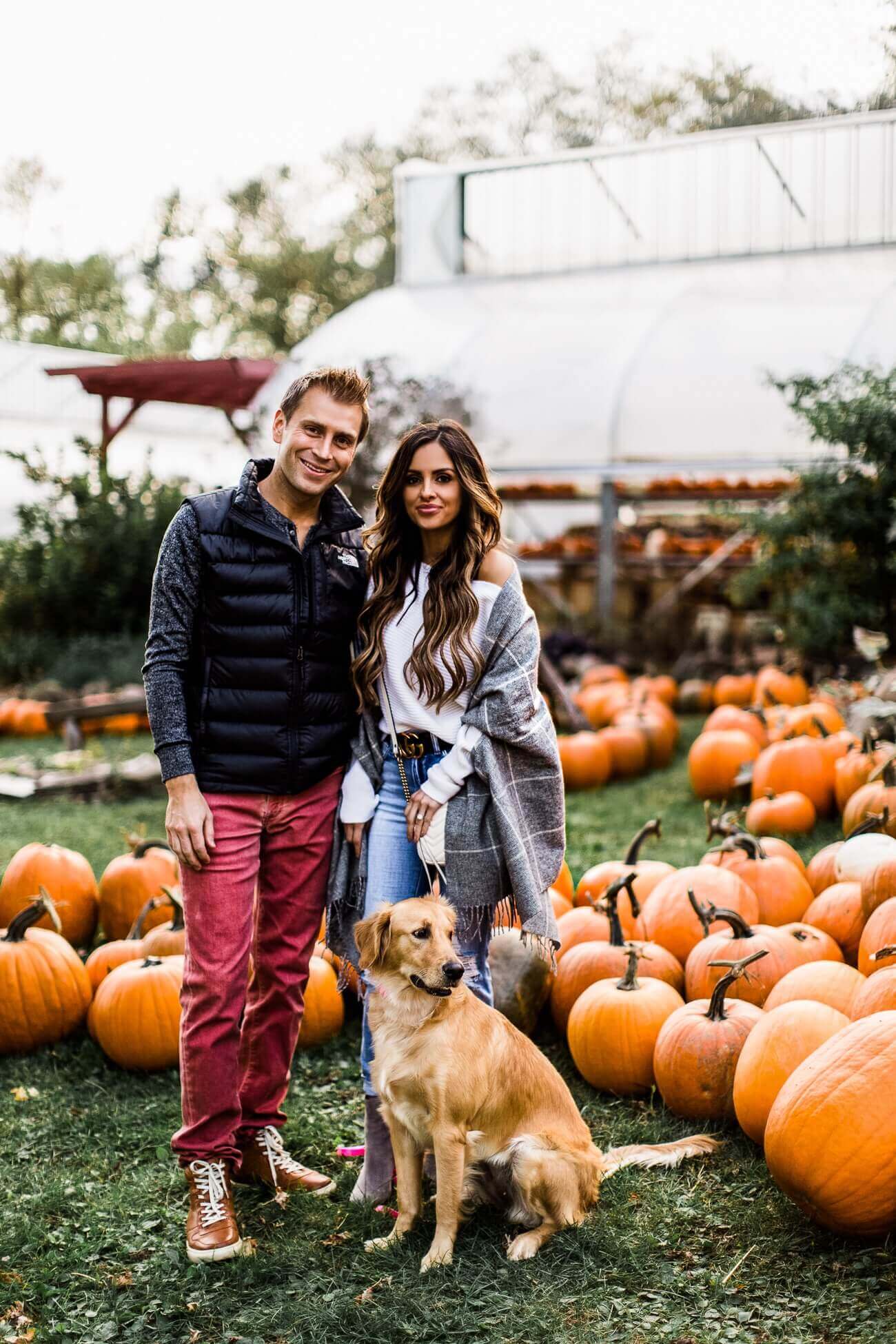 mia mia mine with husband phil and golden retriever at a pumpkin patch