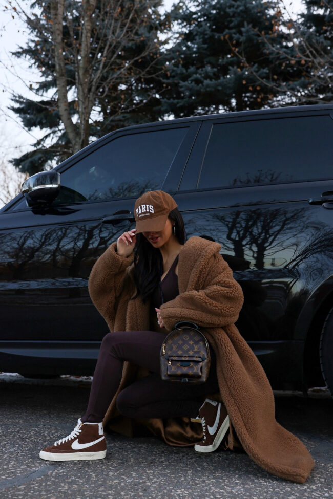 fashion blogger mia mia mine wearing a max mara teddy bear coat and nike sneakers from nordstrom