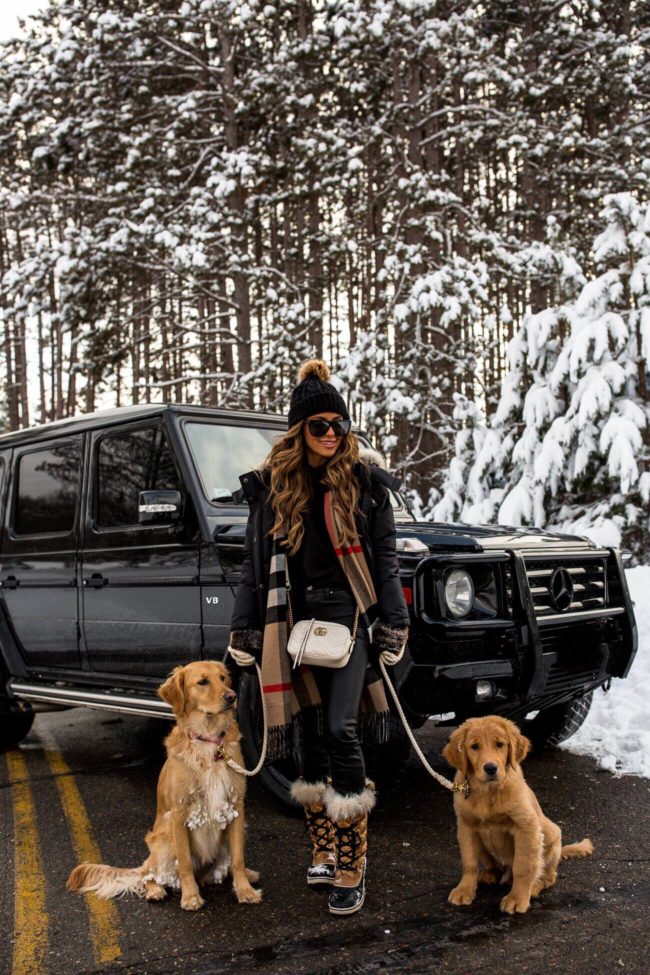 fashion blogger mia mia mine wearing sorel boots and a burberry scarf