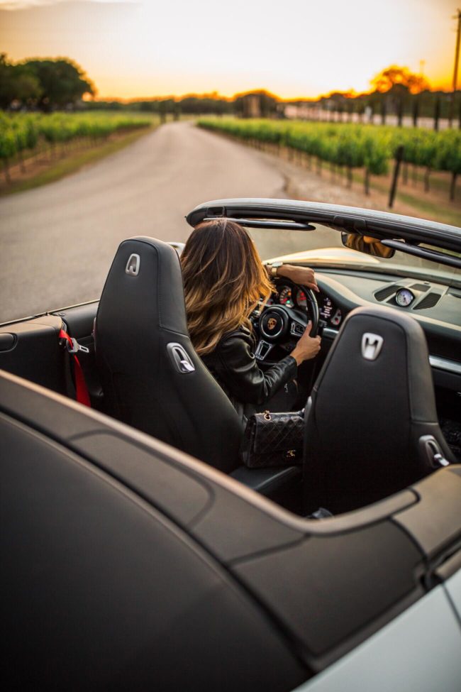 mia mia mine driving a porsche convertible 911