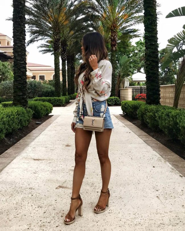 fashion blogger mia mia mine wearing a floral bodysuit in orlando