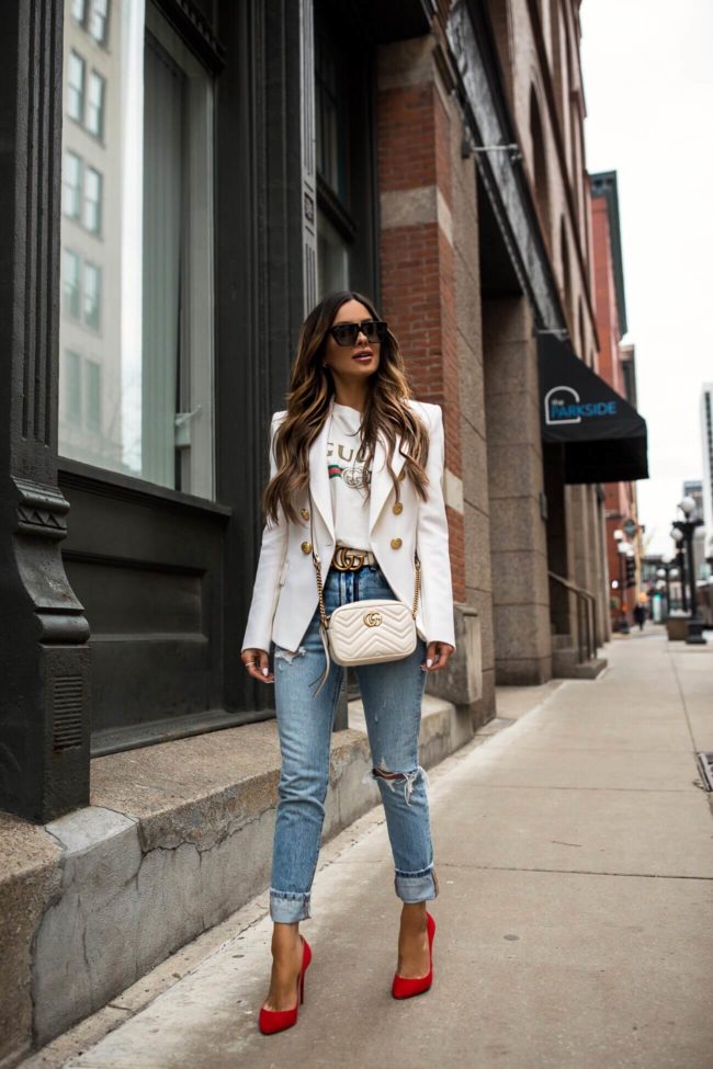 fashion blogger mia mia mine wearing a balmain blazer and a gucci belt