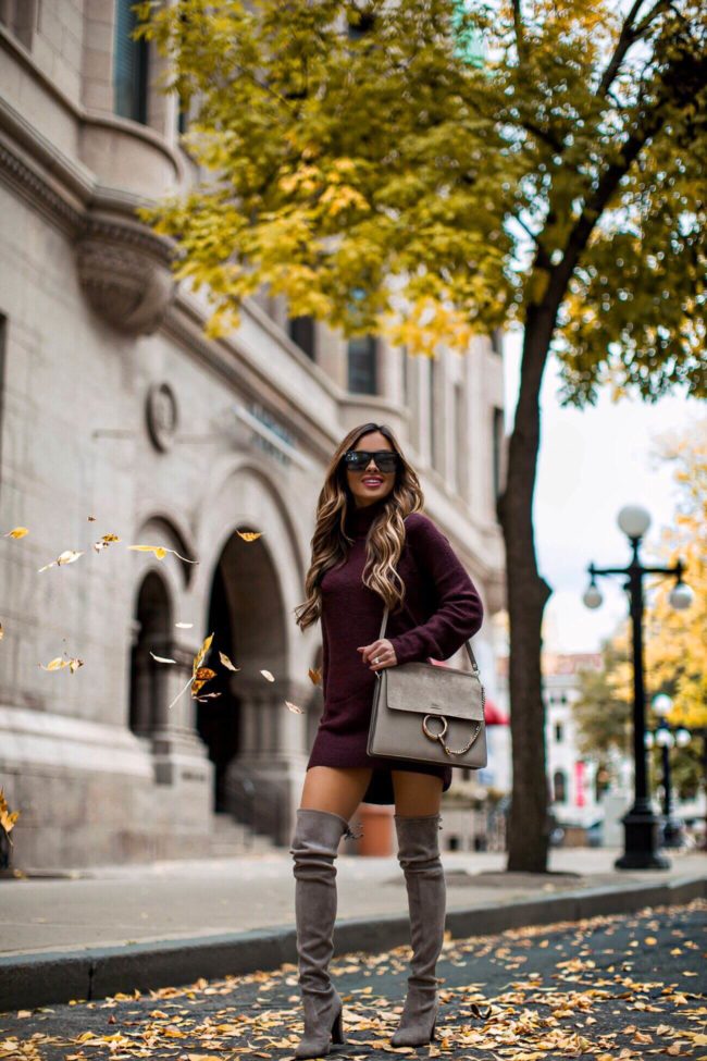 fashion blogger mia mia mine wearing a burgundy sweater dress from H&M and stuart weitzman over-the-knee boots