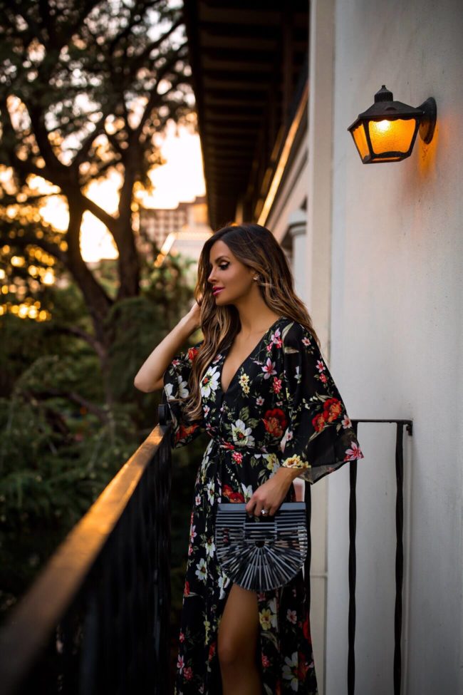 fashion blogger mia mia mine wearing a floral dress for a wedding