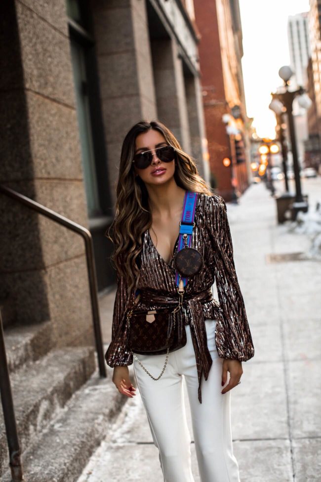 fashion blogger mia mia mine wearing a louis vuitton multi pochette bag for the holidays