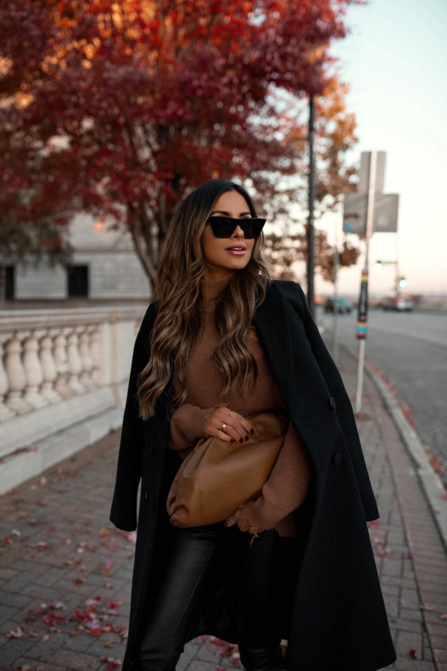 fashion blogger wearing a camel bottega veneta pouch