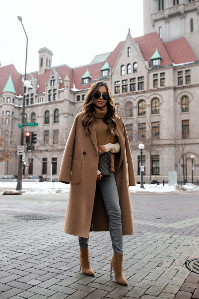 fashion blogger mia mia mine wearing a camel coat and gray denim from revolve