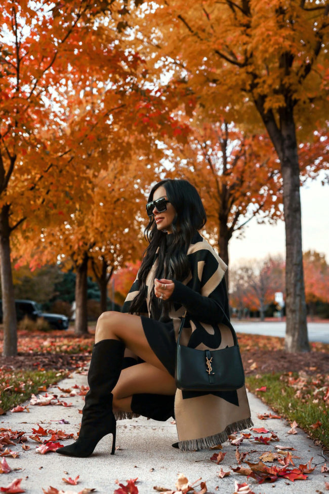 fashion blogger mia mia mine wearing schutz suede boots and a burberry scarf from saks