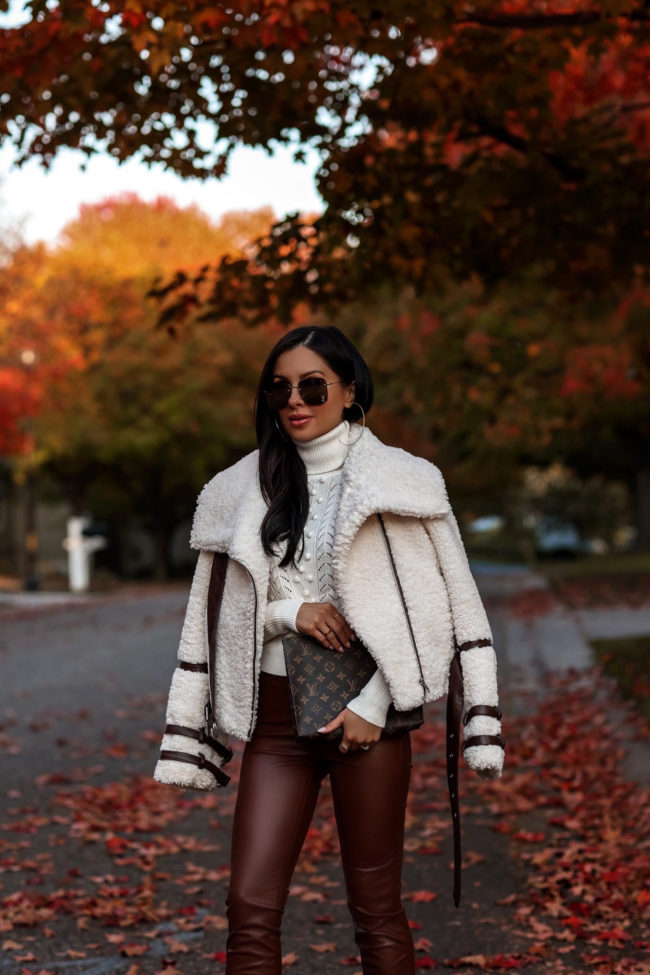 mia mia mine wearing a shearling biker jacket from revolve