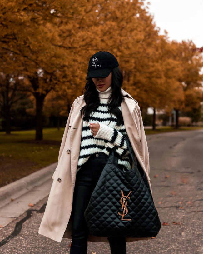 fashion blogger wearing a trench coat and stripe sweater