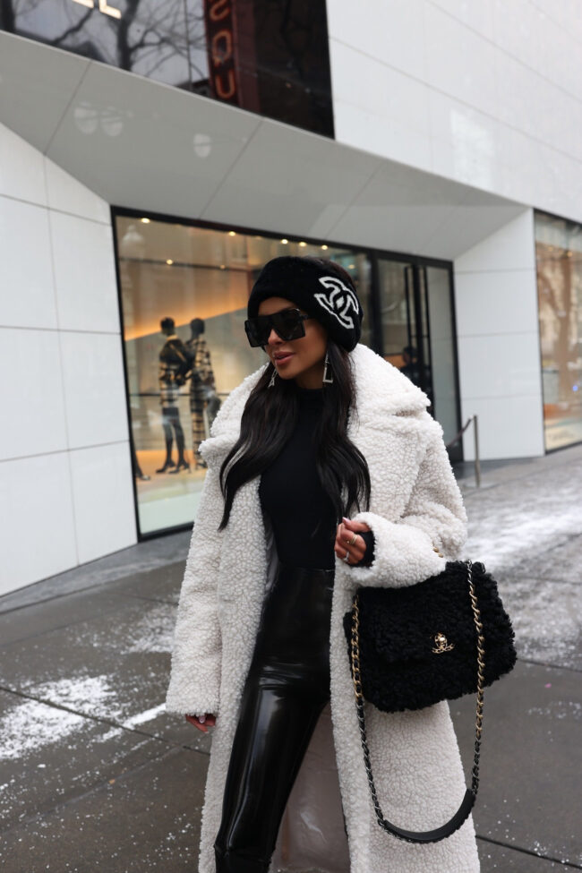 mia mia mine wearing a chanel 19 shearling handbag