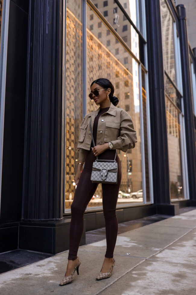 fashion blogger wearing a brown catsuit