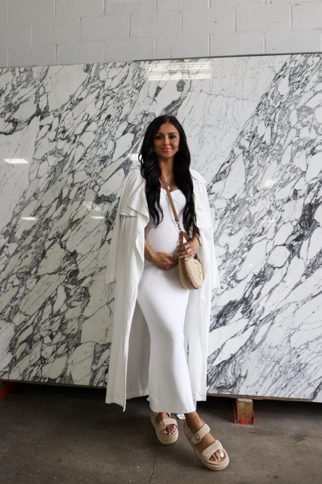 fashion blogger wearing an all white maternity outfit