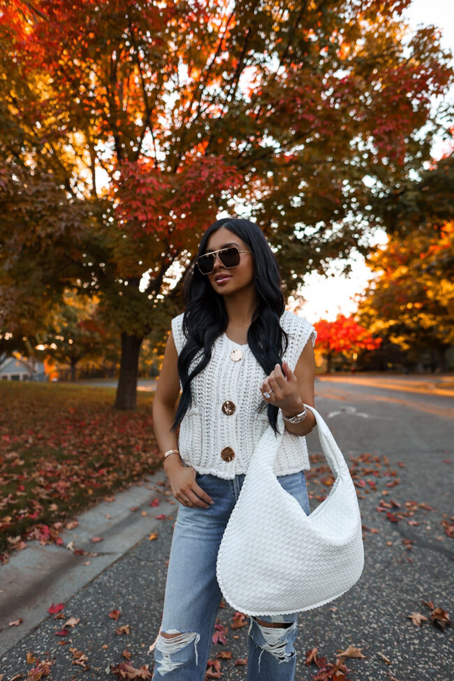 amazon fashion blogger wearing a knit cardigan and woven handbag