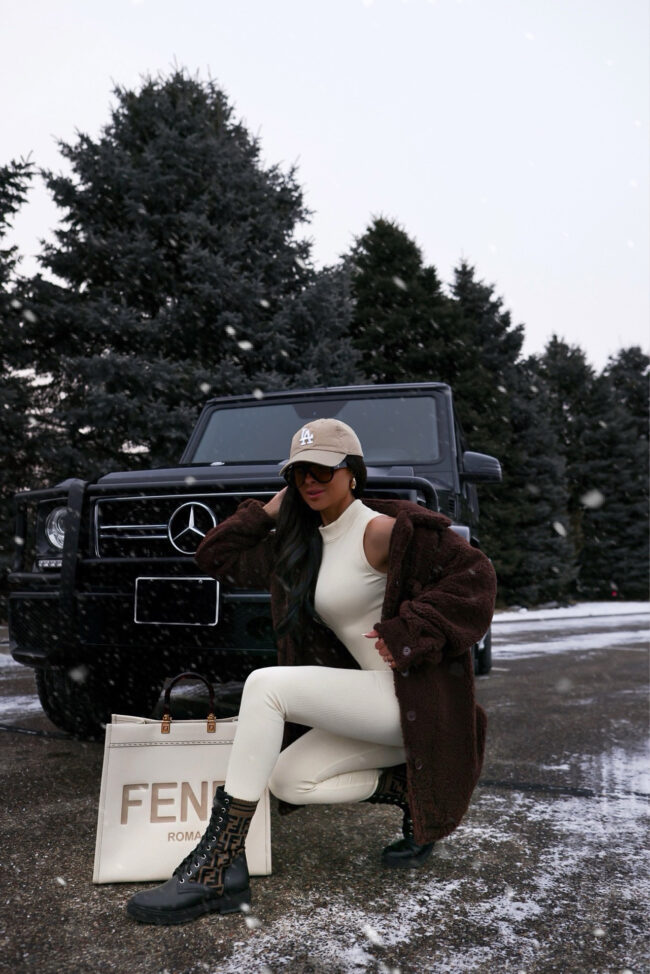 brunette fashion blogger wearing fendi combat boots