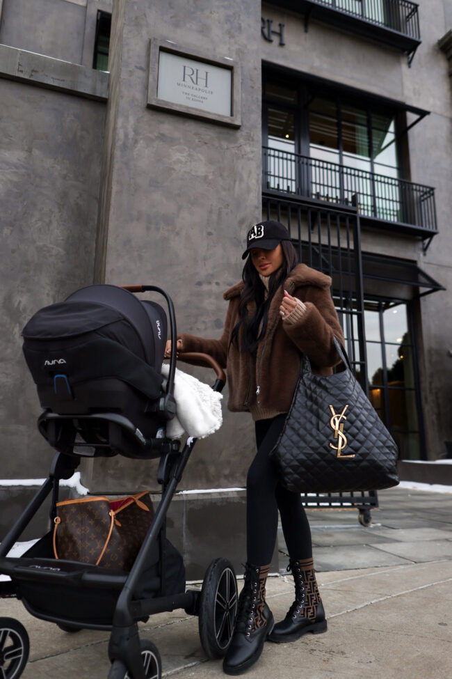 brunette fashion blogger wearing leggings and a faux fur jacket